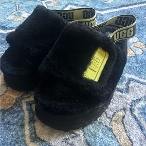 UGG Black Fuzzy Slide Mules with Yellow Logo Accents